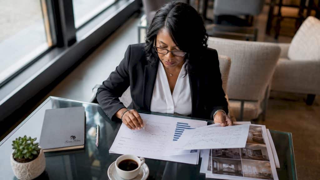 Real estate agent reviewing market timing documents