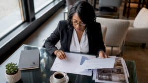 Real estate agent reviewing market timing documents