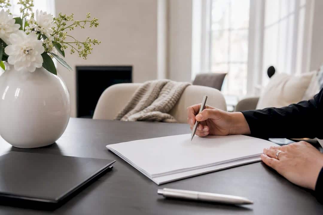 Hands holding blank real estate disclosure form