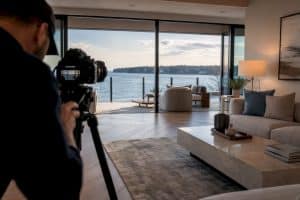 Videographer filming a waterfront home tour