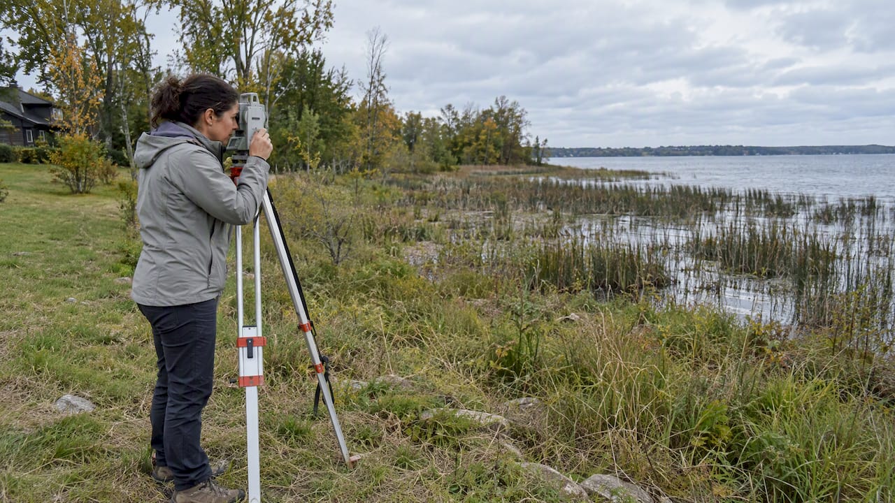 Surveyor checking a Lake Simcoe waterfront lot