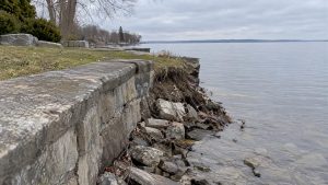 Eroding Lake Simcoe bank beside retaining wall