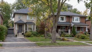 Detached house beside a semi-detached pair