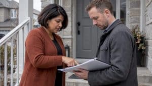 Landlord and broker reviewing rental coverage