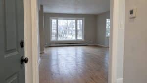 Empty Ontario home with thermostat and bare floors