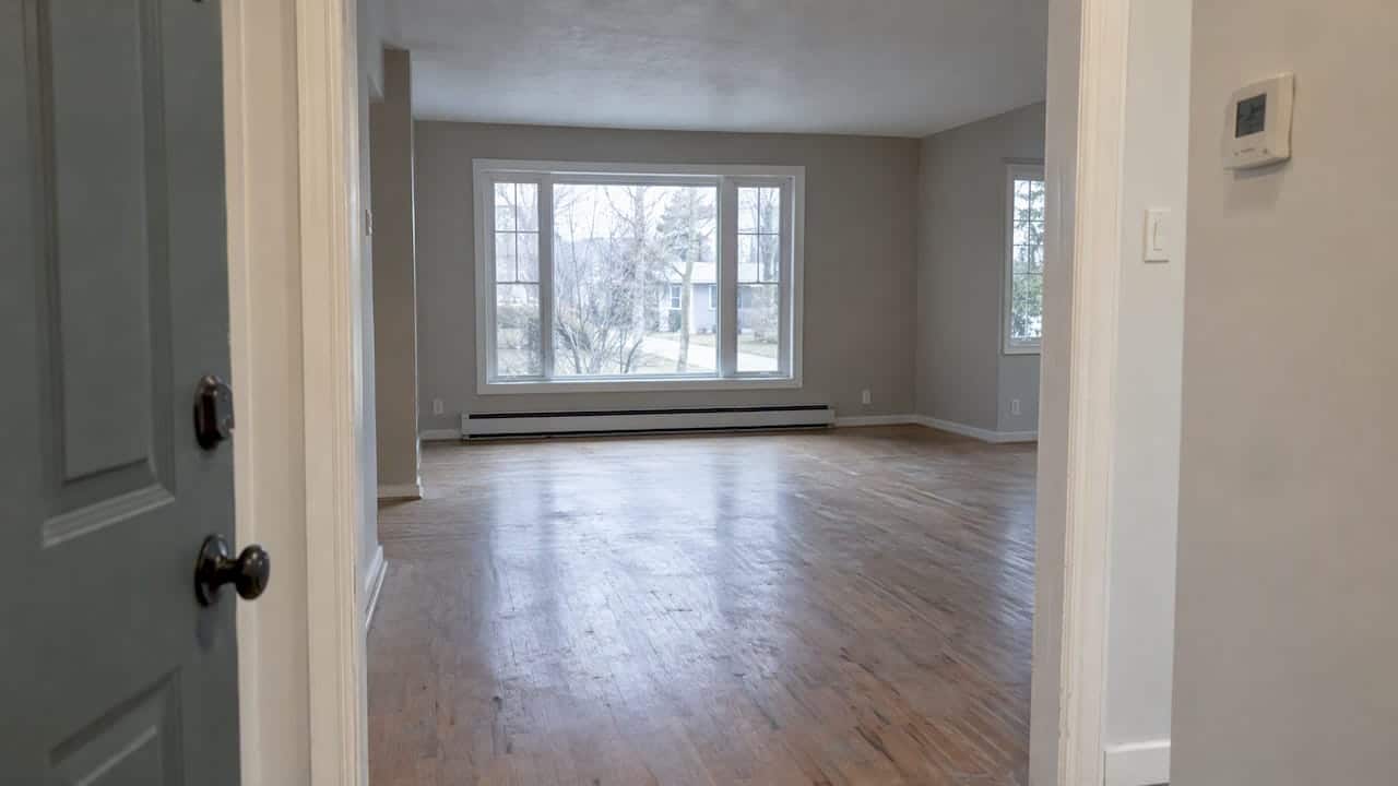Empty Ontario home with thermostat and bare floors